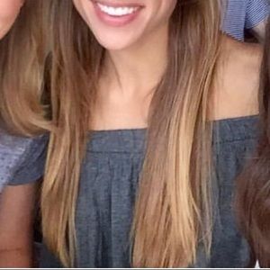 Cropped, off the shoulder grey shirt